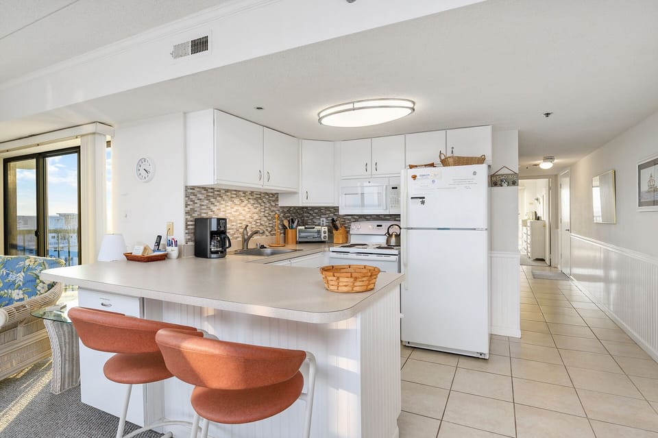 Sit at the Breakfast bar and keep the cook company!