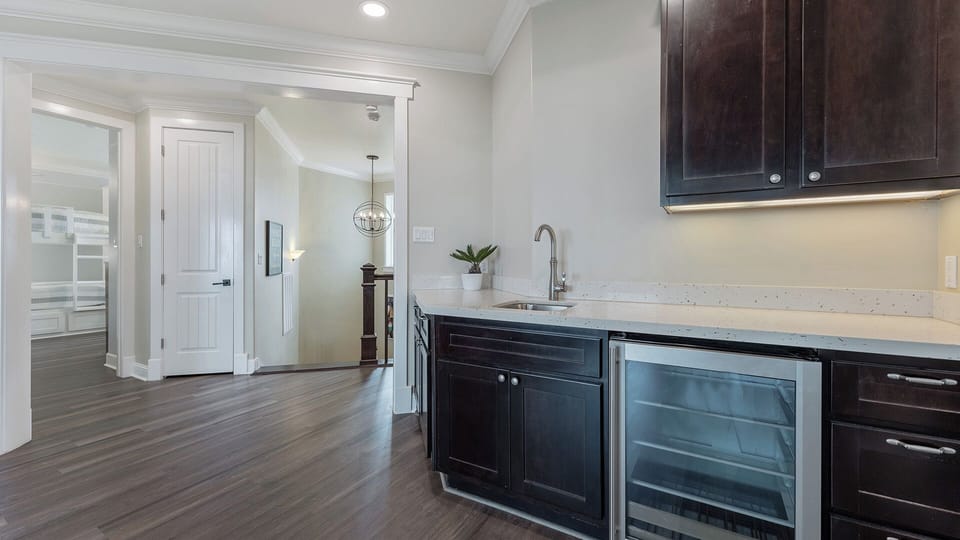 2nd Floor Living Room: With sink, fridge, and wet bar for unwinding at the end of the day.