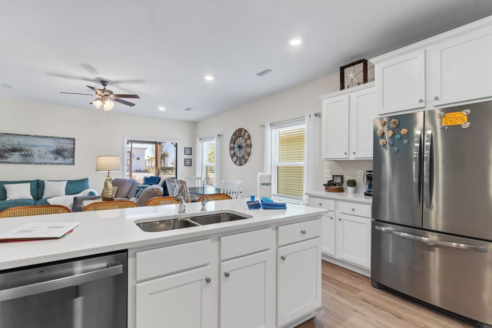 Your fully-equipped kitchen flows seamlessly into the cozy living area, perfect for preparing meals while staying connected with family and friends.