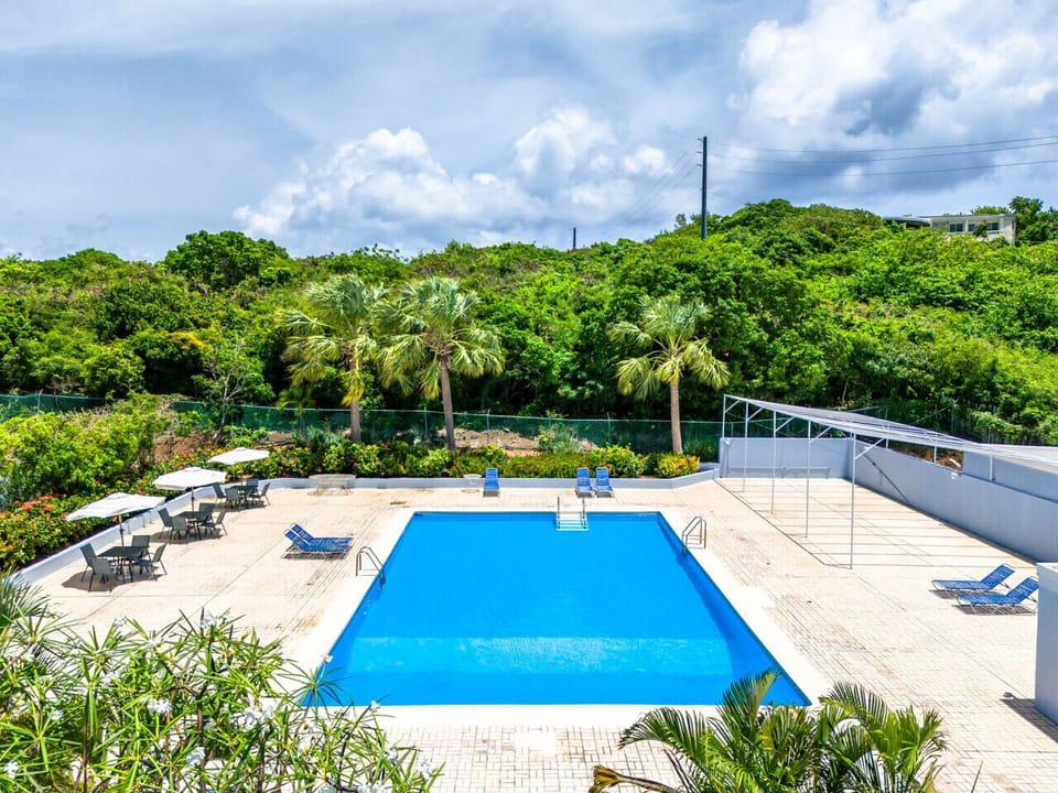 Huge pool with tables and umbrellas and plenty of sun loungers!