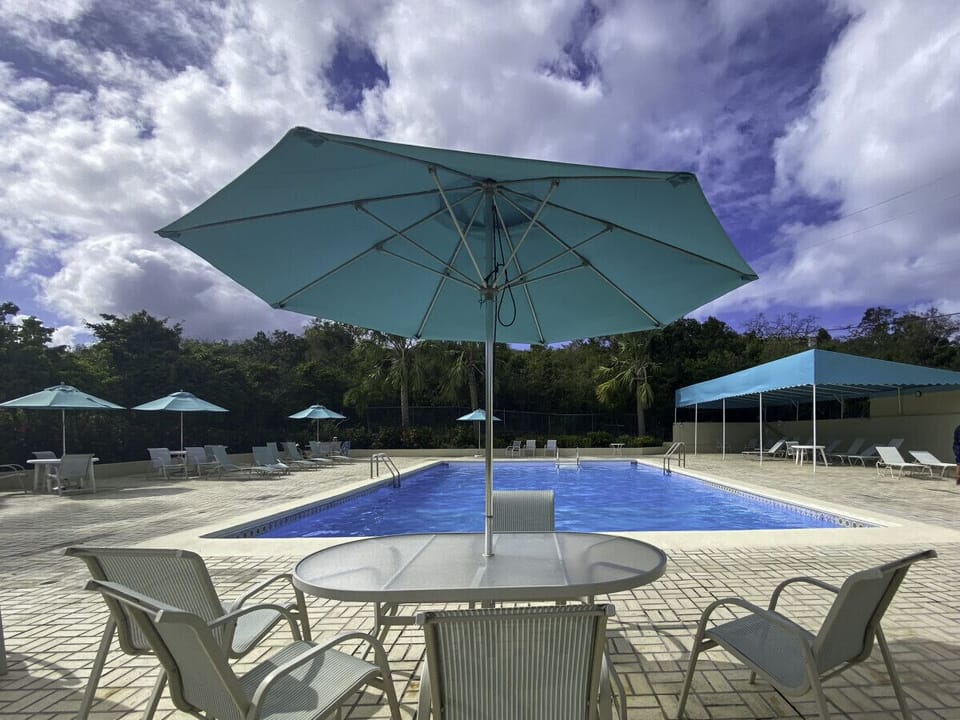 Huge pool with tables and umbrellas and plenty of sun loungers!