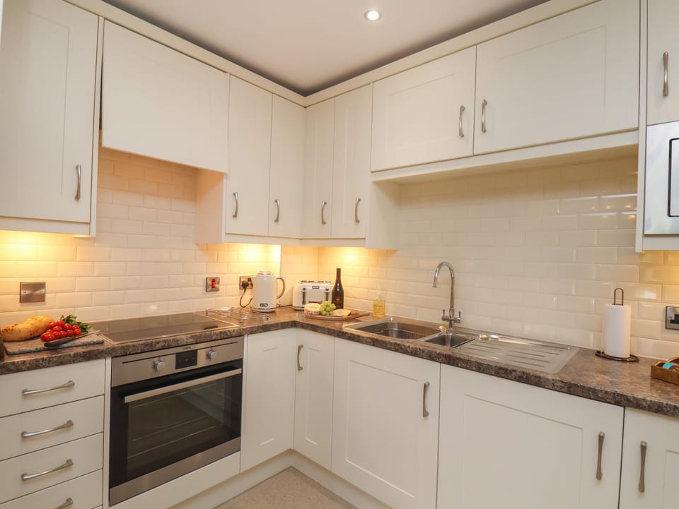 Fridge, electric kettle, cookware/dishes/utensils