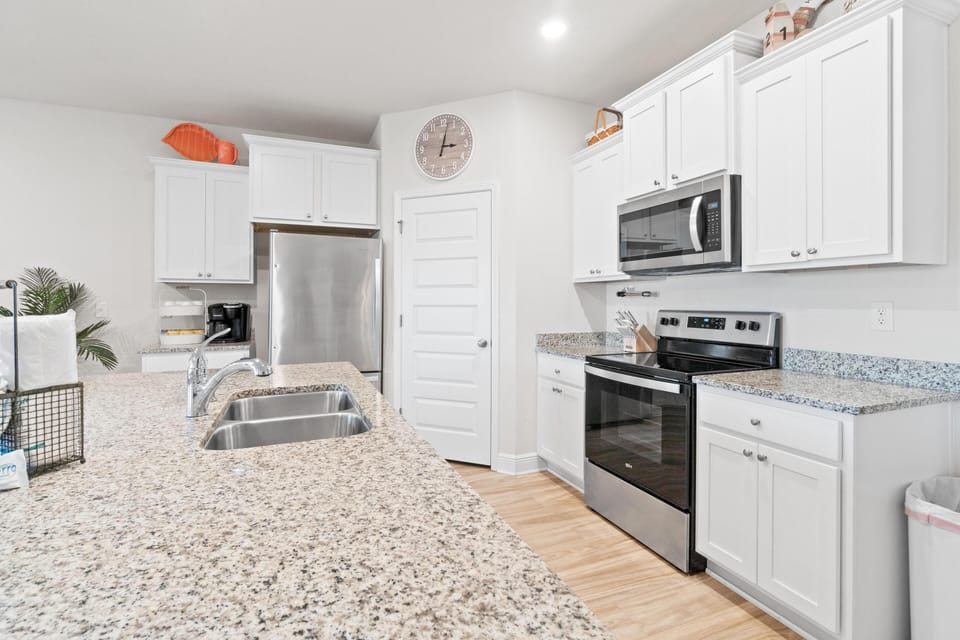 Your fully equipped kitchen awaits with granite countertops, stainless steel appliances, and everything you need to prepare memorable meals during your stay.