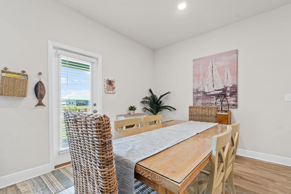 Gather around your coastal dining table, where wicker meets wood in perfect harmony, creating memorable meals together.