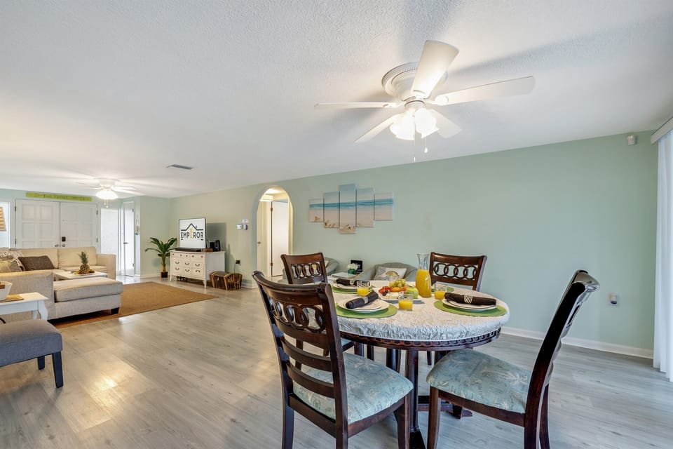 Nestled in an open layout, this dining haven seamlessly connects to both the kitchen and living area, creating a harmonious flow throughout the space.
