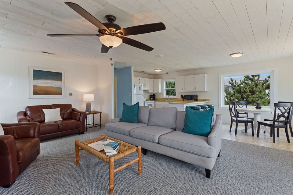 Relax in the large, open-concept Living Area with a Flat Screen TV and plenty of cozy furniture.
