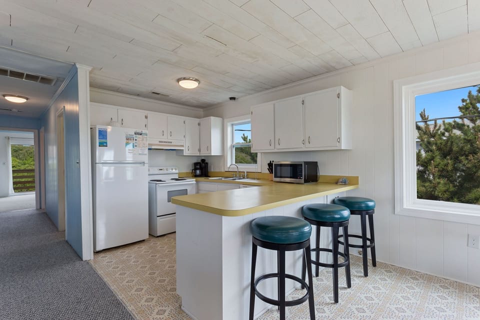 Whip up something delicious in the Kitchen with modern appliances to enjoy in the Dining Area or at the Counter Bar.