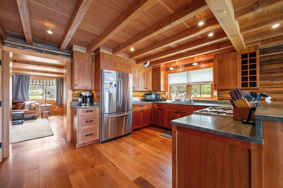 Kitchen with view into living area