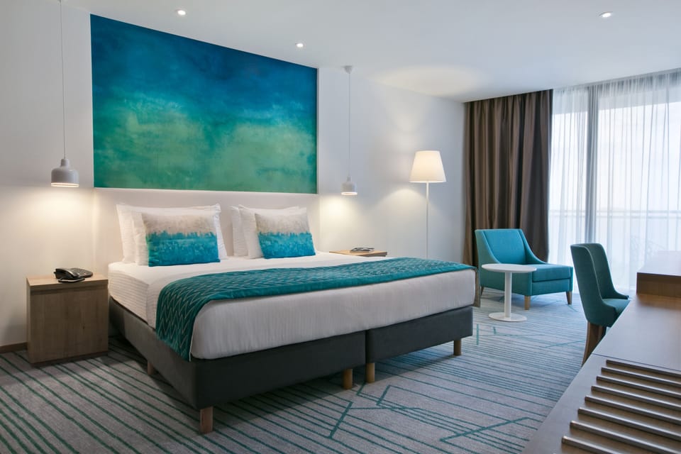 Superior Double or Twin Room, Balcony, Partial Sea View | Minibar, in-room safe, desk, soundproofing