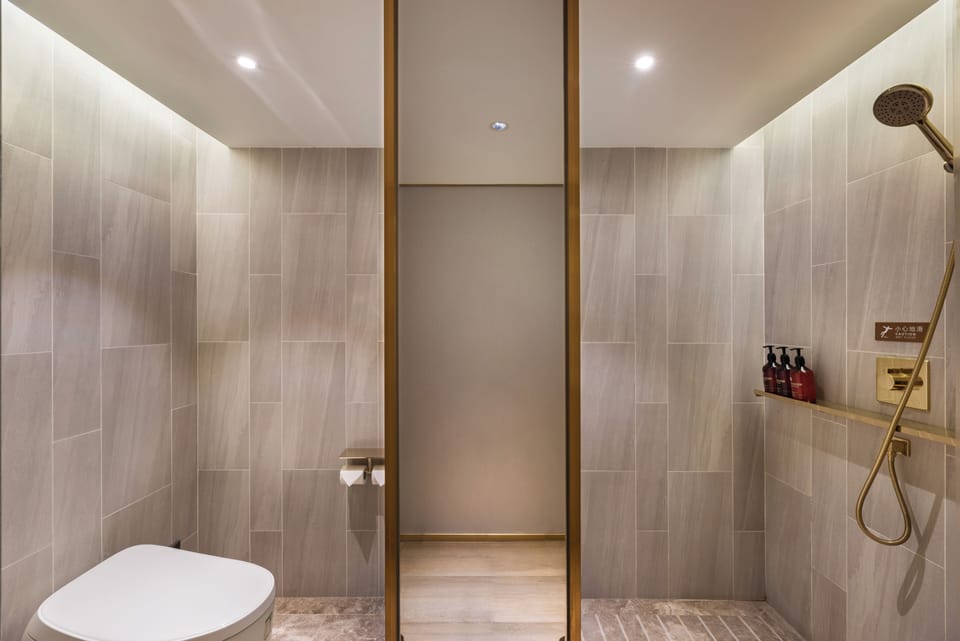 Shower, rainfall showerhead, designer toiletries, hair dryer