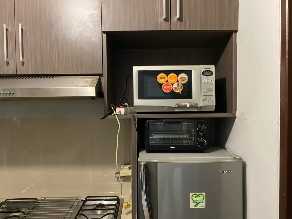 Apartment | Private kitchen | Full-size fridge, microwave, stovetop, rice cooker