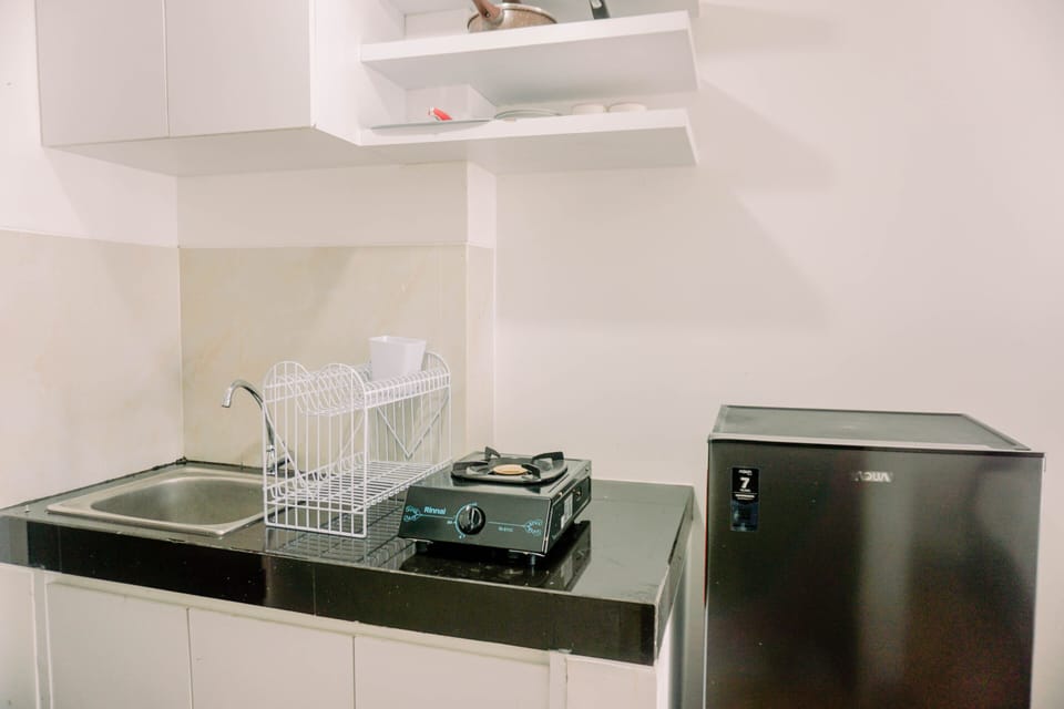 Apartment | Private kitchen | Full-size fridge, stovetop, rice cooker, cookware/dishes/utensils
