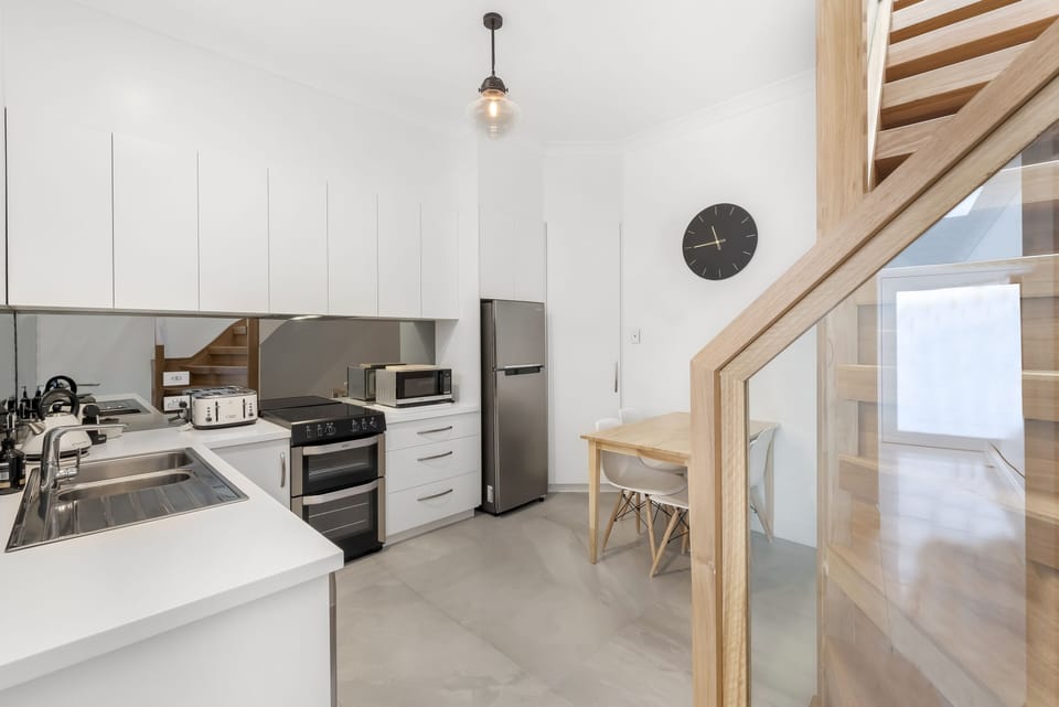 Design Apartment | Private kitchen | Full-size fridge, microwave, oven, stovetop