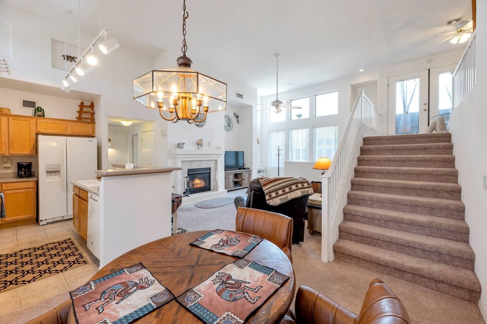 The unit has a nice open floor plan on the main level with living room, dining and kitchen