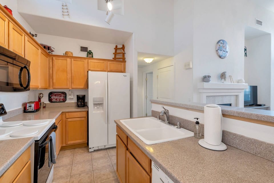 Kitchen with microwave, stove/oven, fridge, dishwasher, utensils etc