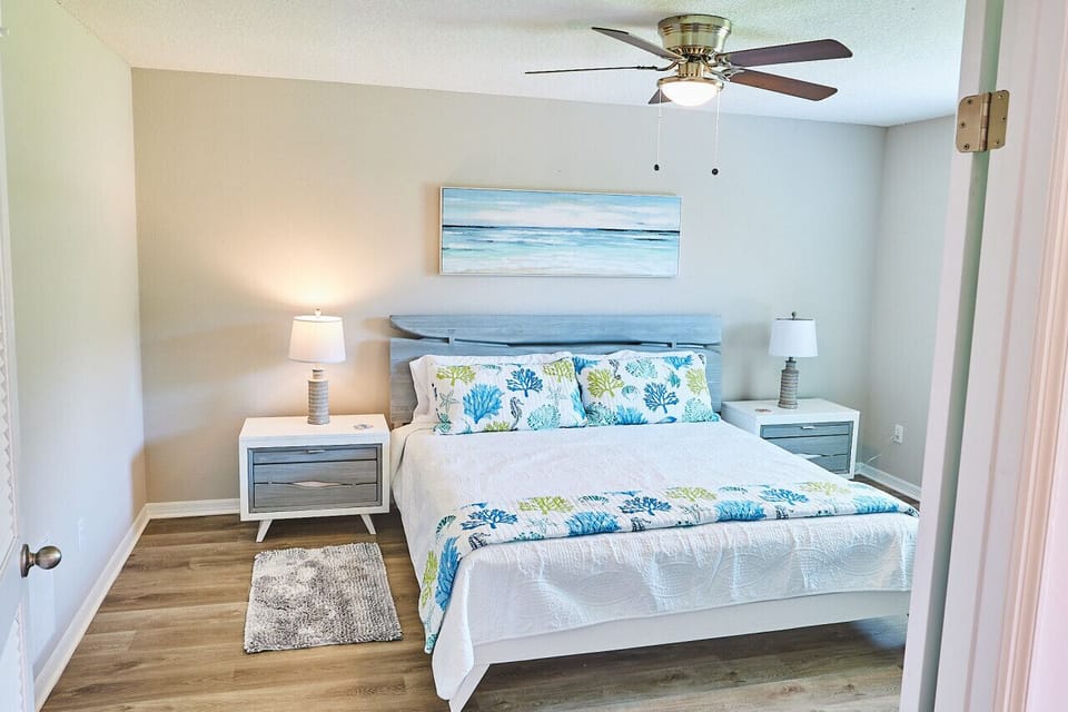 Spacious room with smart TV and private bathroom.