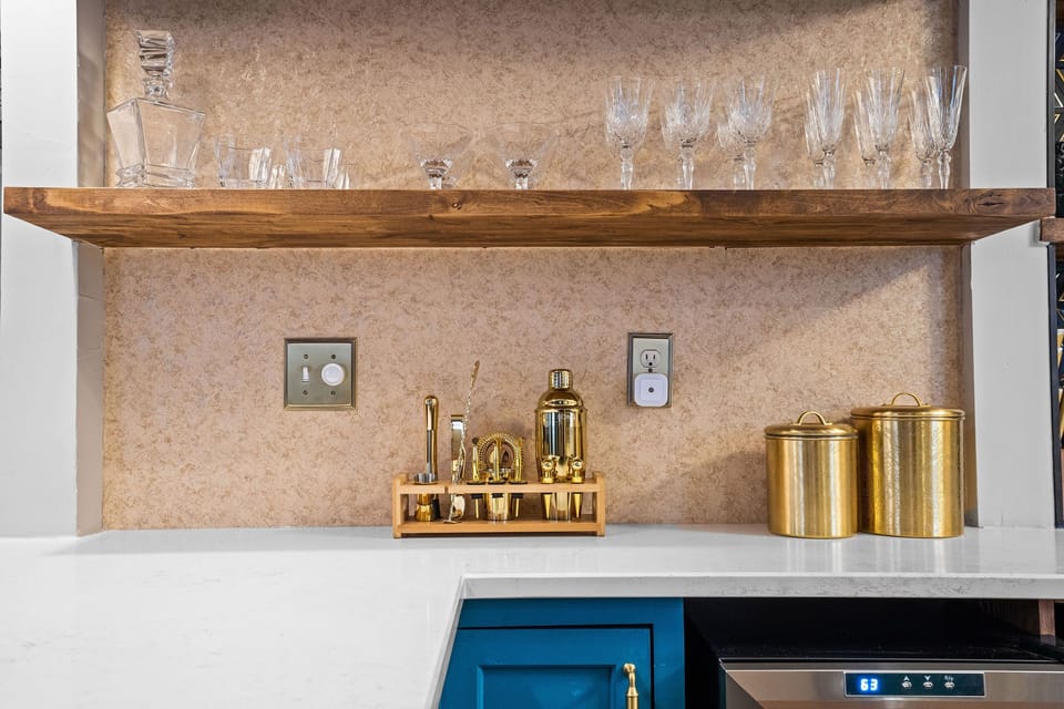 Enjoy a beautifully curated kitchen with ample counter space, sleek finishes, and a full suite of cookware—ideal for guests who love to cook while staying in walkable Midtown KC.