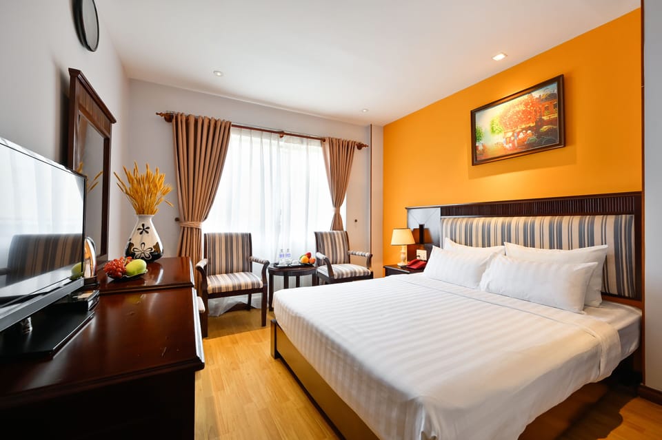 Deluxe Double or Twin Room | Living area | Flat-screen TV