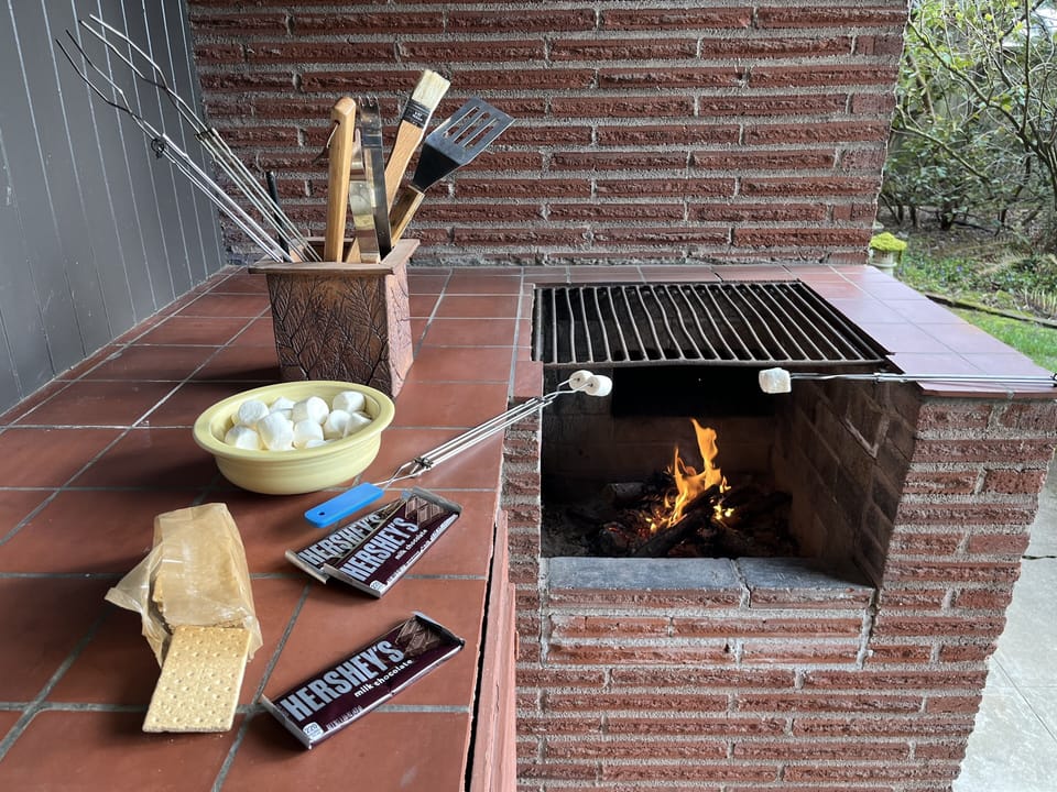 Patio fire pit drafts into chimney for smoke free enjoyment. $15 firewood.