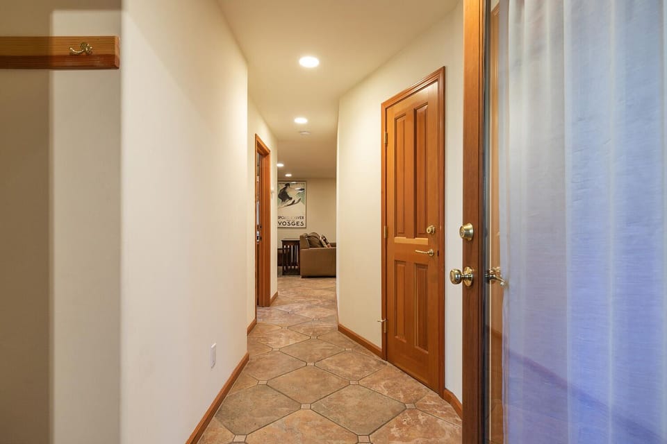 A welcoming hallway leading to the home’s comfortable bedrooms.