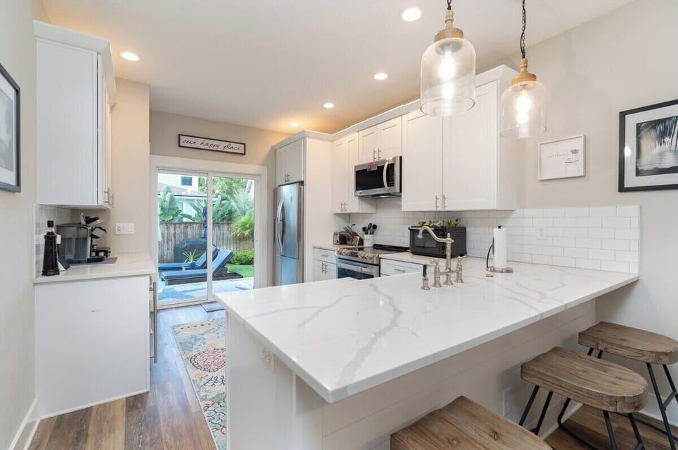Kitchen - Quartz countertop with all of the kitchen essentials. 

Access to the backyard and private pool straight ahead!