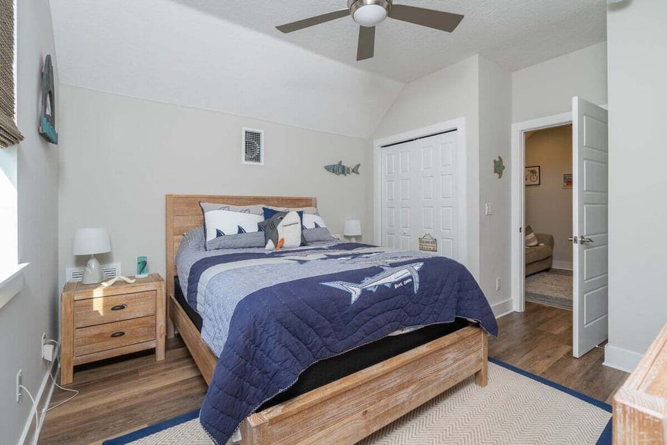 2nd floor guest bedroom with queen bed, smart TV, closet.
