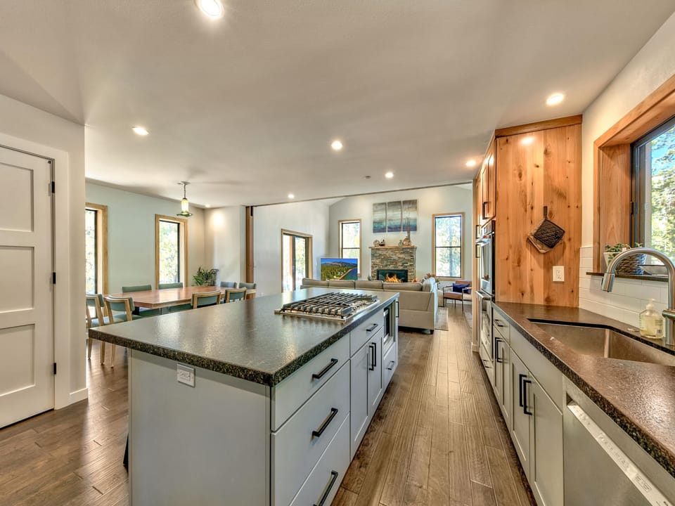 Large kitchen island with cook top and downdraft vent