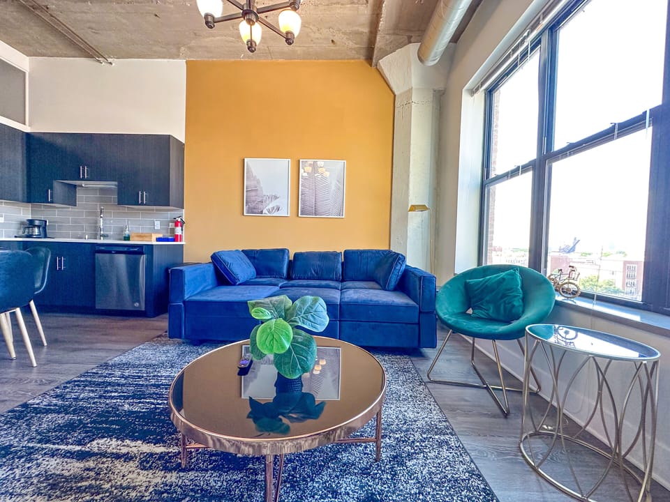 Spacious living room with a lot of natural light and large windows