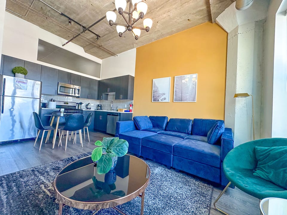 Spacious living room with a lot of natural light and large windows