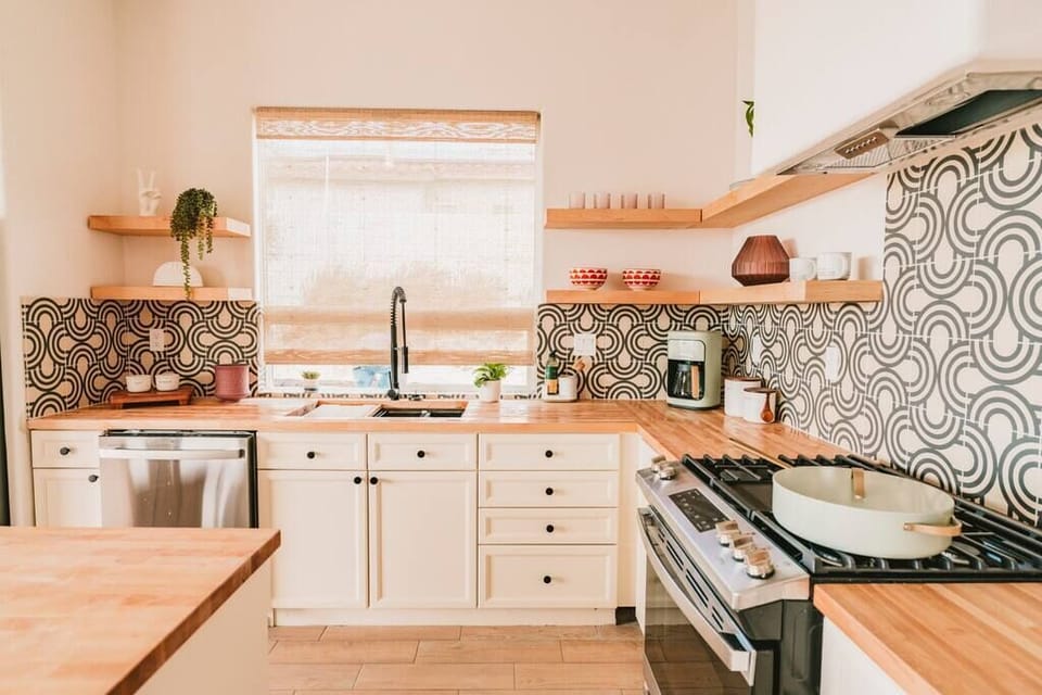 Fully equipped chef's kitchen and fully stocked bar with wine fridge. Gas range, multiple coffee makers (traditional drip, Keurig, pour-over), kettle, microwave, dishwasher, large fridge, all pots, pans and utensils.