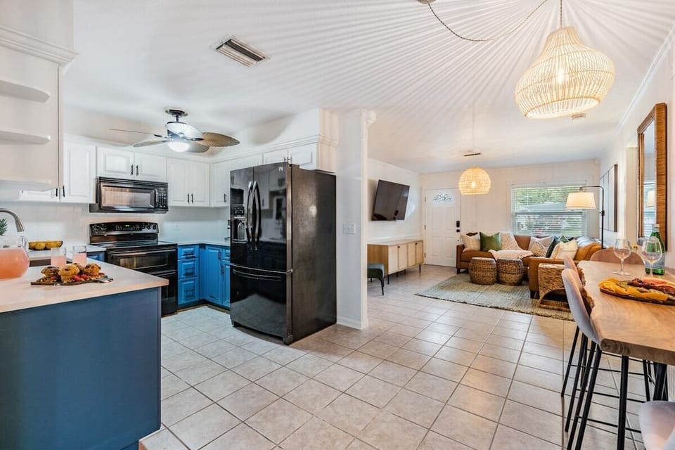 Kitchen full sits in between the dining room and living room.