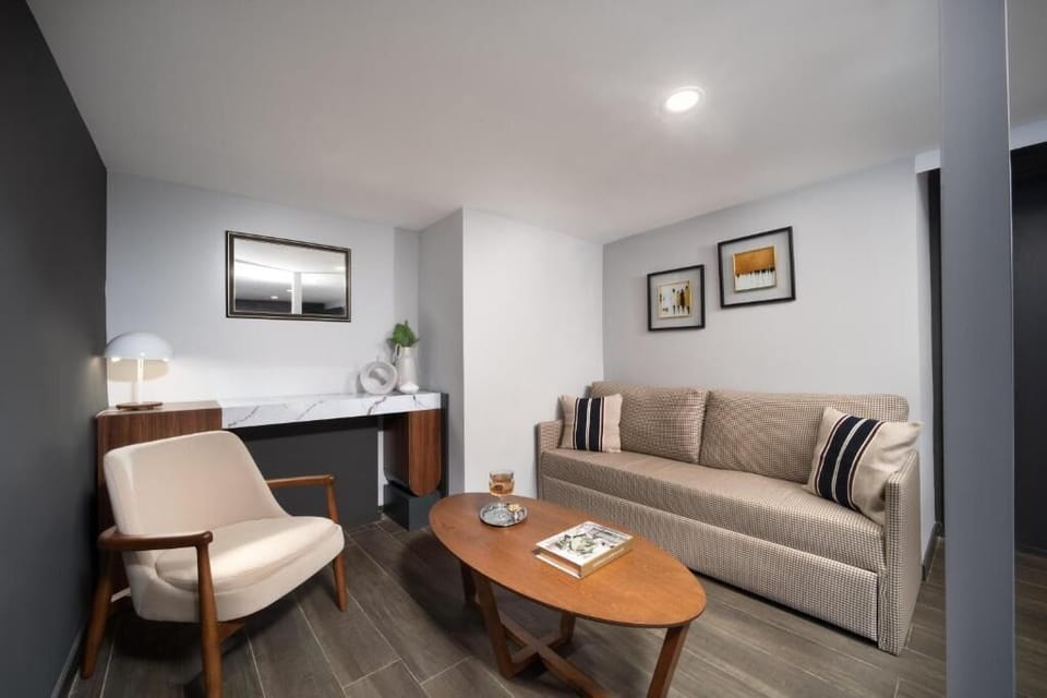 Family Studio Suite | Living area | Flat-screen TV