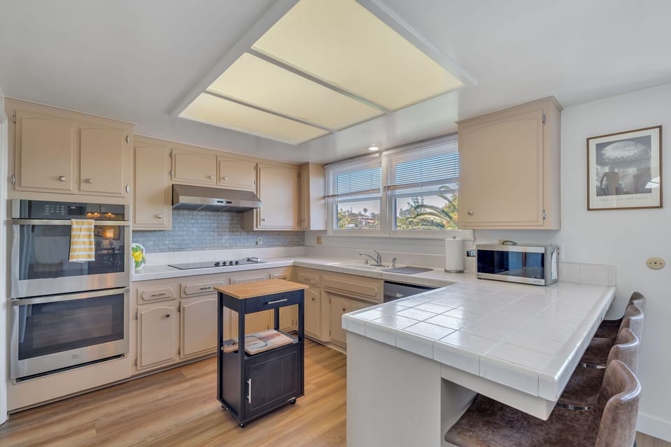 Fully stocked kitchen with bar stool seating
