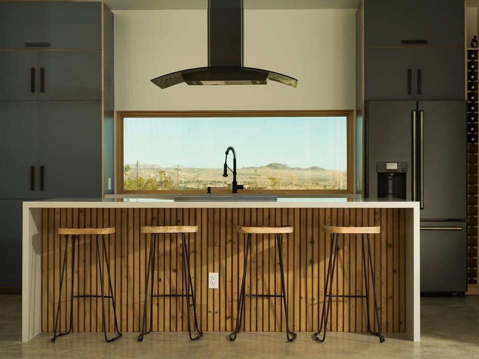 Indulge your culinary desires in our gourmet kitchen, a haven for food lovers and entertainers alike. This meticulously designed space is a chef's dream, boasting high-end appliances, a large island, and an Italian Bertazzoni induction range!
