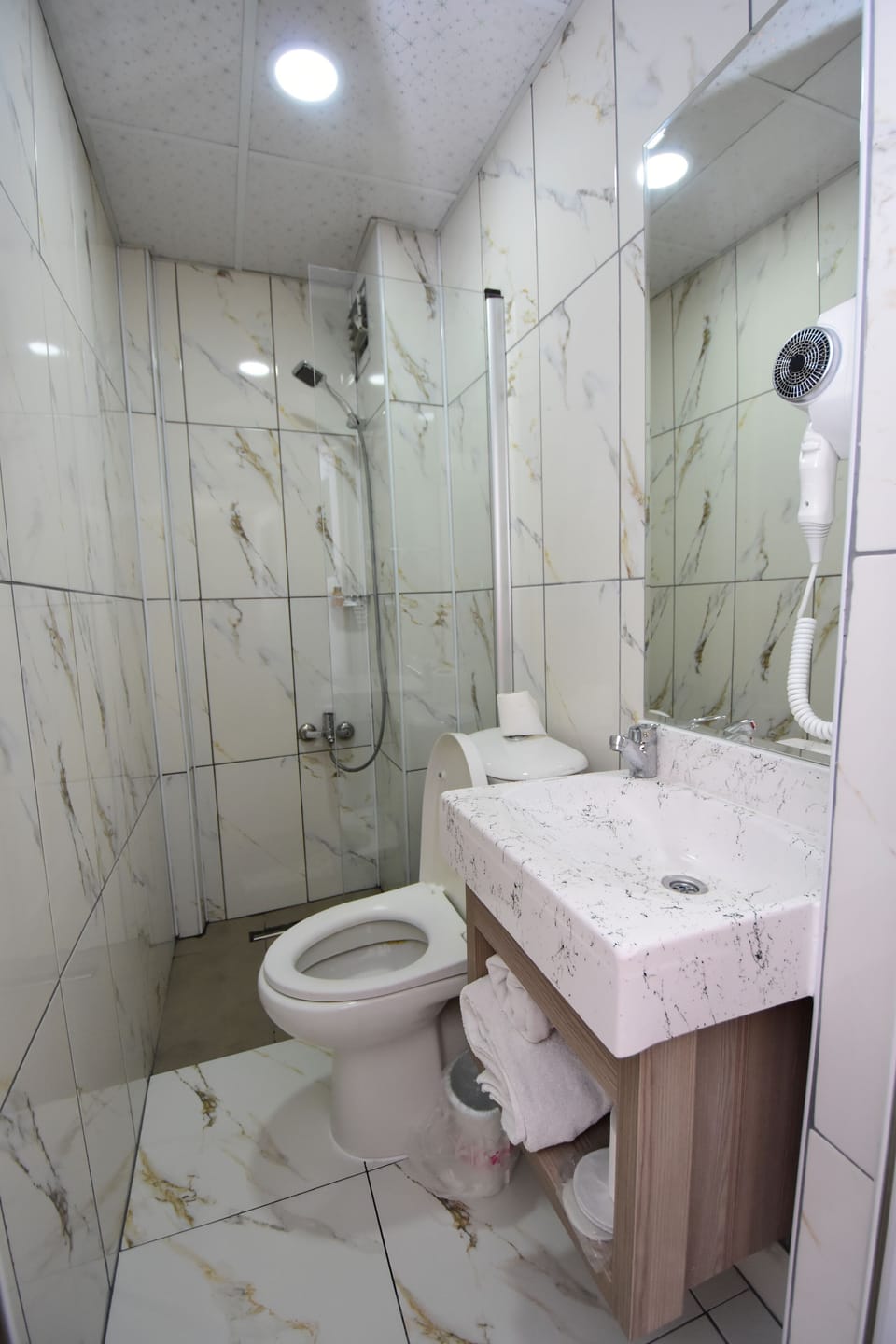 Comfort Room | Bathroom | Shower, rainfall showerhead, hair dryer, towels