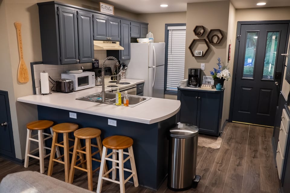 Full kitchen and stools for the bar