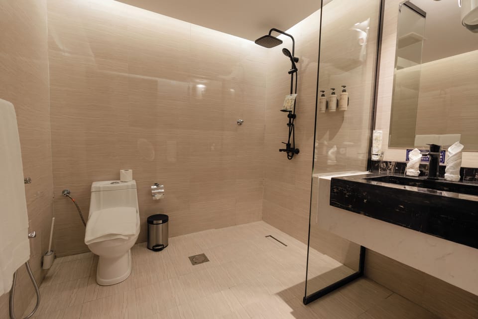 Shower, rainfall showerhead, towels, soap
