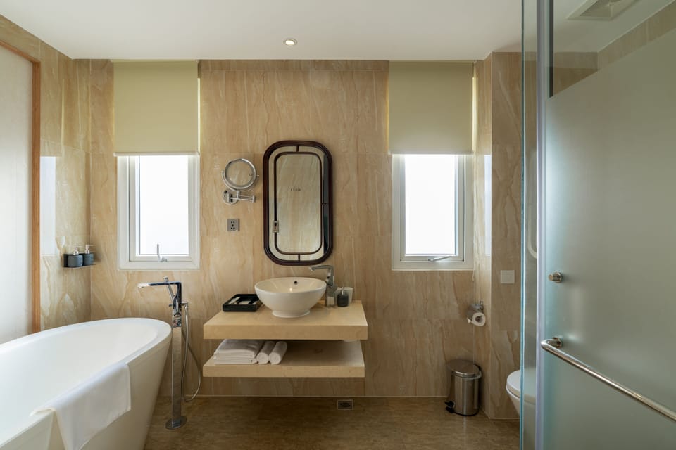 Separate tub and shower, rainfall showerhead, free toiletries