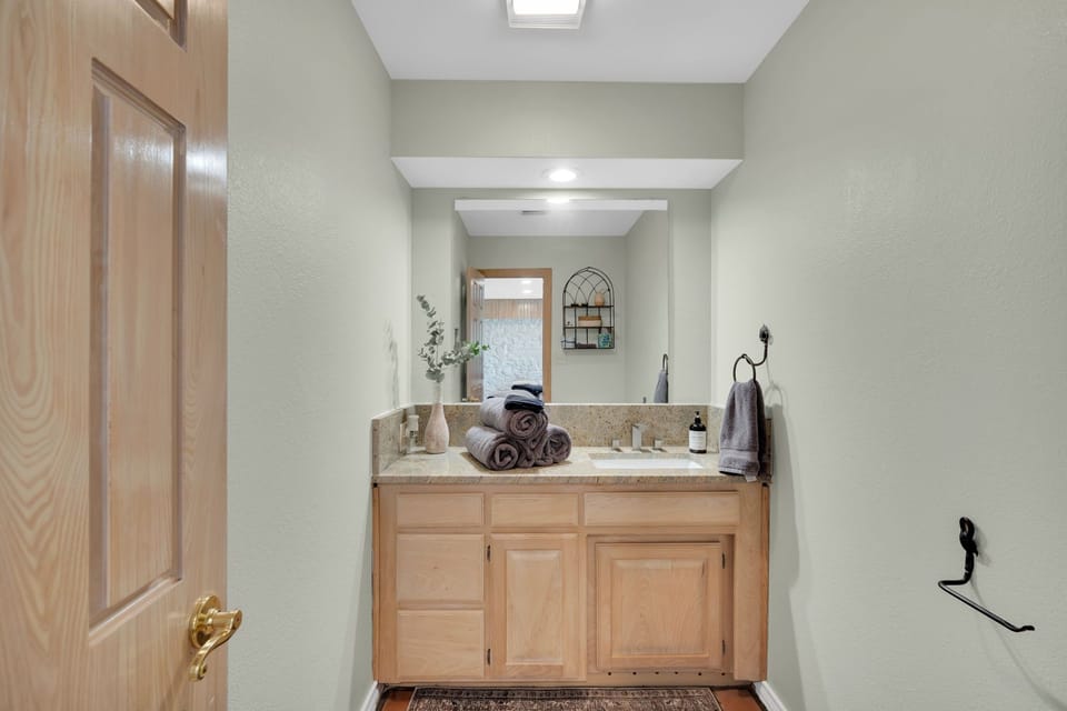 1/2 Bath, off downstairs living room and close to pool deck