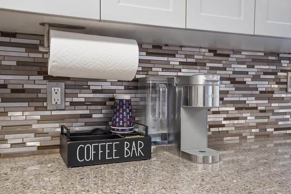 Coffee bar with keurig, coffee pods, tea, and to-go cups