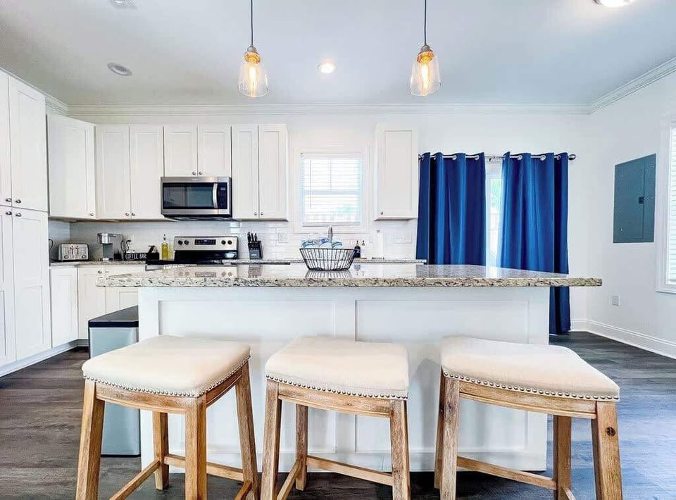 Kitchen shot leading to back slider