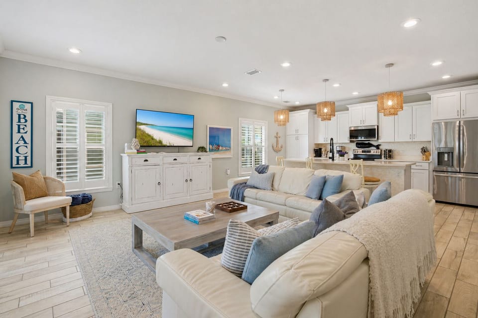 The open space combines the kitchen and living room, creating a great and welcoming area. Perfect for socializing and relaxation, the seamless layout invites you to enjoy cooking, dining, and unwinding together in comfort.