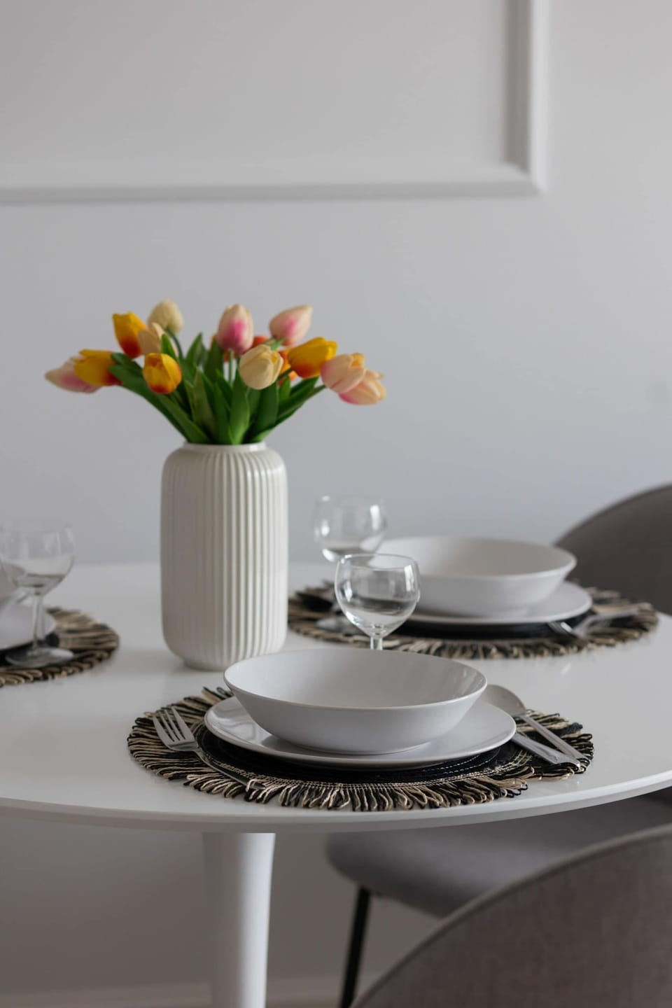 A cozy table setup with fresh flowers and elegant tableware, adding charm to the dining experience.
