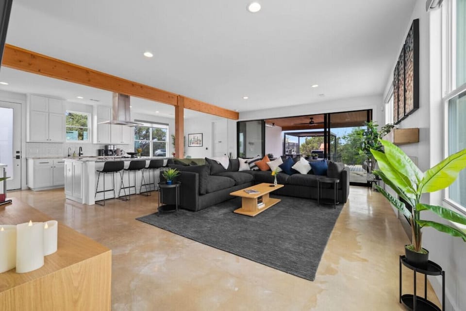 Sink into the living area`s welcoming ambiance with a 75` smart TV, Sonos soundbar, and cozy fireplace. Lounge and bond in this comfy space designed for relaxation and social interaction.