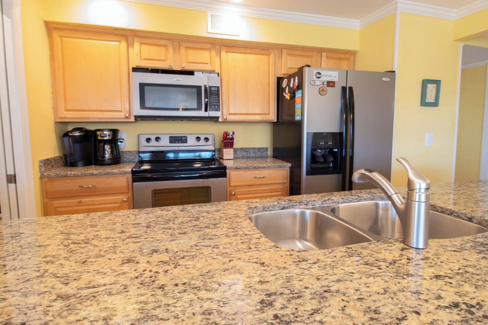 Your fully equipped kitchen features modern stainless appliances, granite counters, and all the tools you need to prepare meals in comfort during your stay.
