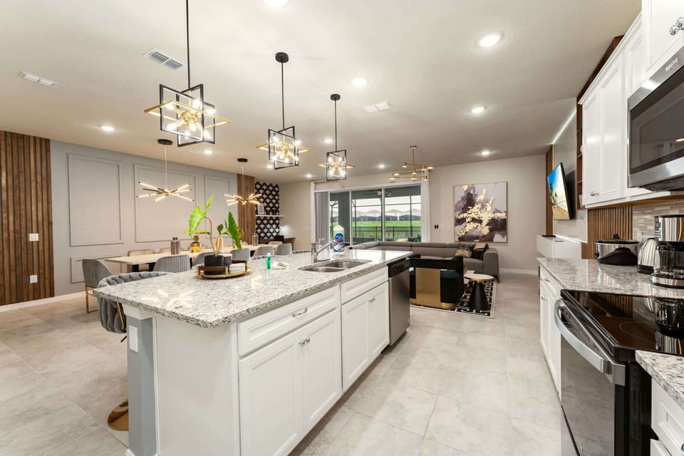 Experience luxury living in this modern open-concept kitchen and living area, perfect for entertaining and relaxation.