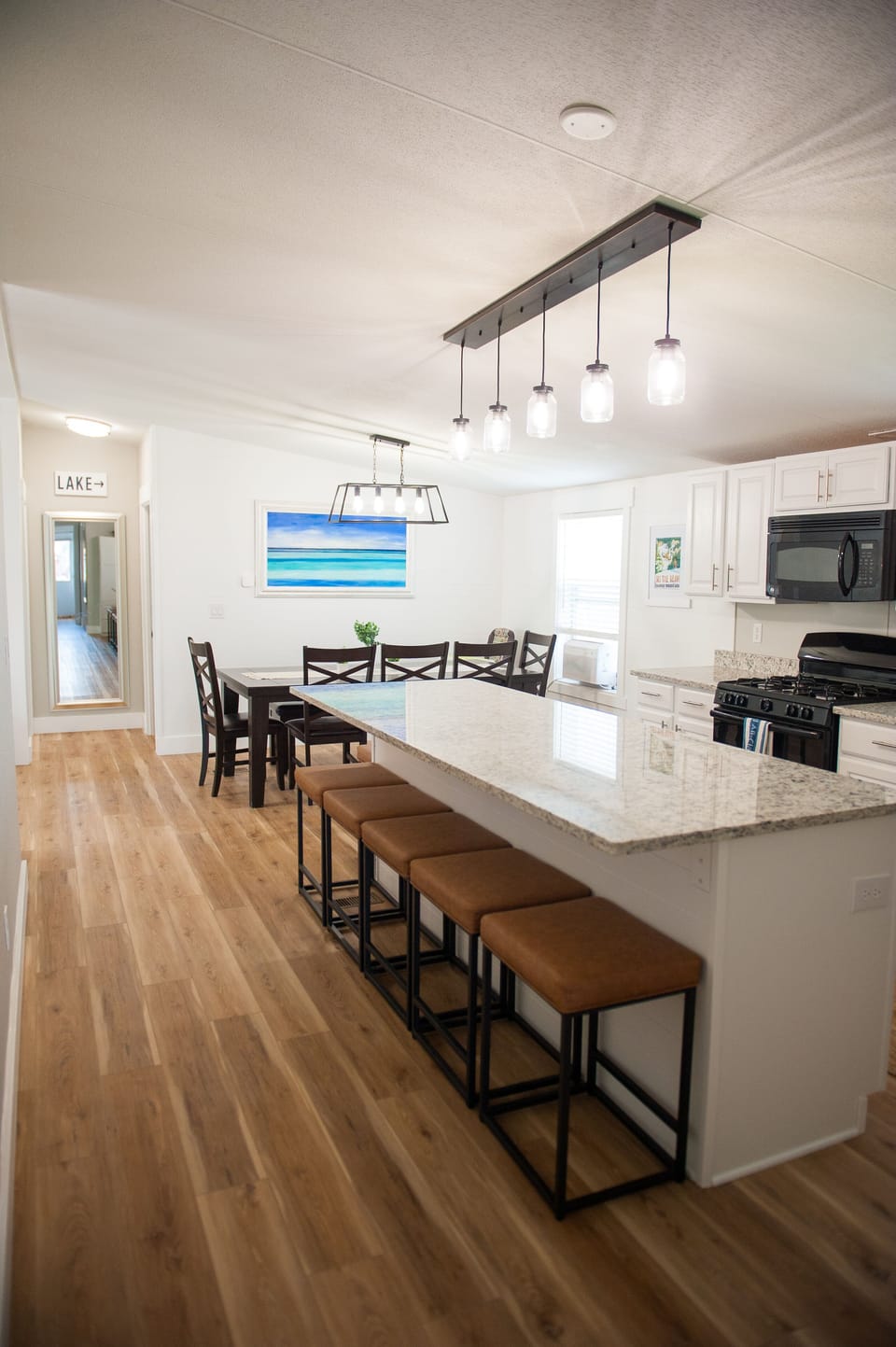 Large island and dining table provides plenty of seating for meals