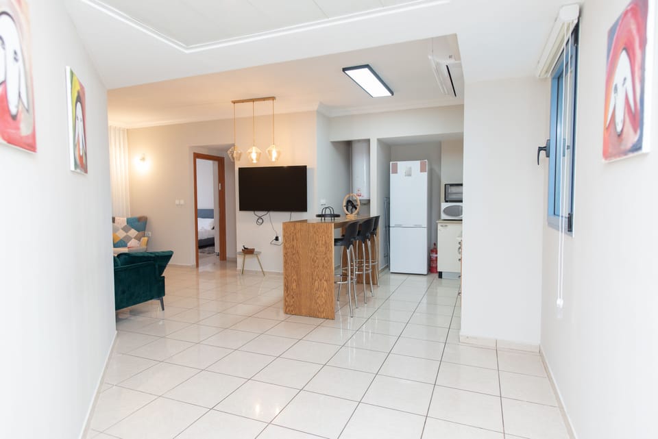Classic Apartment | Living area | 50-inch flat-screen TV with cable channels, TV
