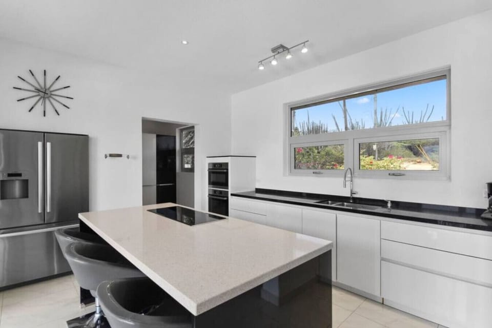 From the top-of-the-line appliances to the spacious countertops, every detail has been carefully curated to inspire your culinary creativity. Elevate your cooking experience in this gourmet kitchen, where your culinary aspirations come to life.