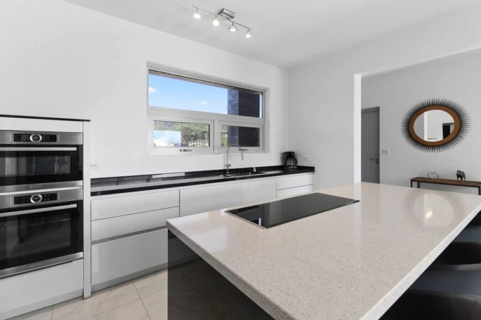 Welcome to the heart of culinary excellence. Our impeccably designed kitchen is a haven for food enthusiasts, boasting a sleek and modern aesthetic.